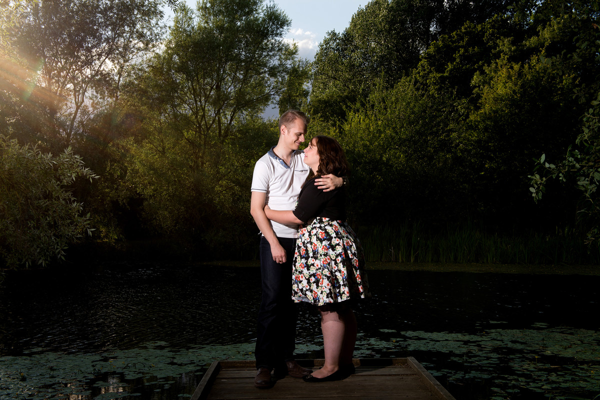 sunlit couple by a lake